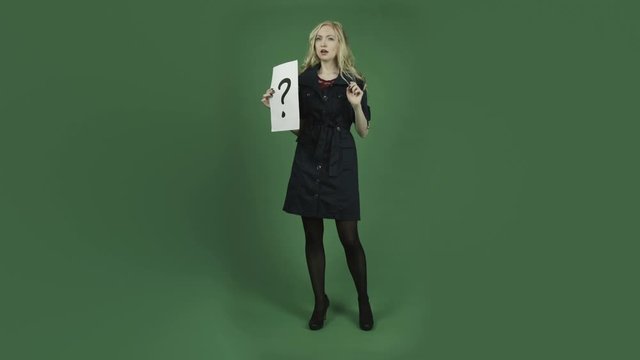 caucasian woman in blue dress isolated on chroma green screen background confused puzzled question mark