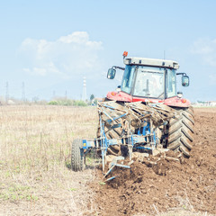  Tractor plowing the stubble field