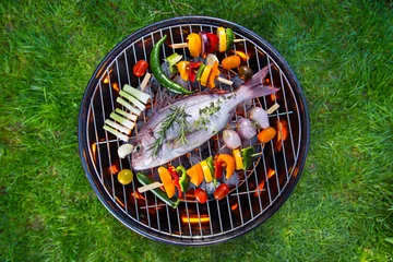 Gardinen Barbecue grill with sea fishes. © Lukas Gojda