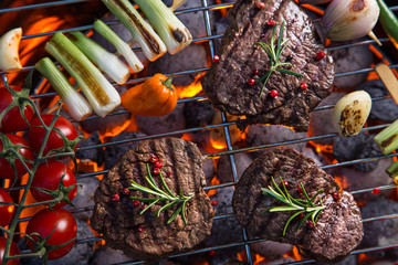 Delicious beef meat with vegetable on a barbecue grill.