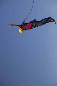 Man jumping off a cliff.