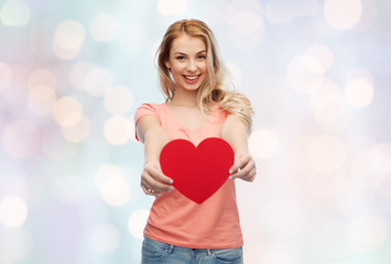 happy woman or teen girl with red heart shape