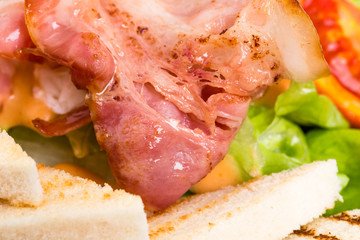 Warm bacon salad with mozzarella and tomatoes.