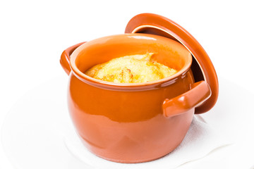 Pork sausages on crock pot with cheese.