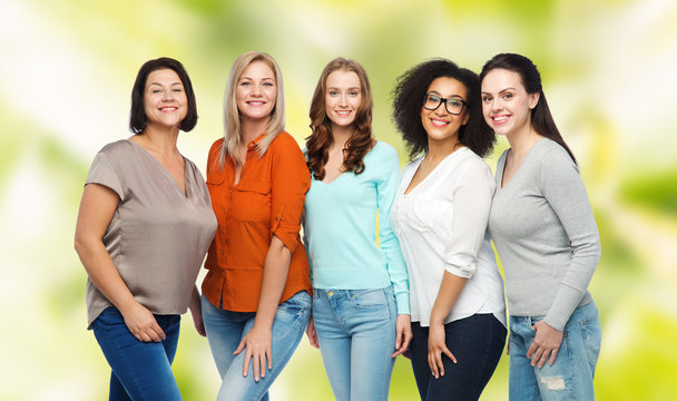 group of happy different women in casual clothes