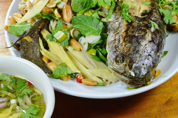 deep fried snake head fish with mixed herb dipping sweet sauce
