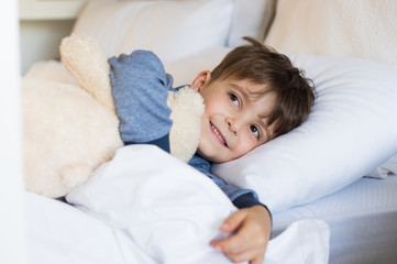 Young boy in bed