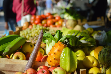 Mixed fruits and vegetables on market stall