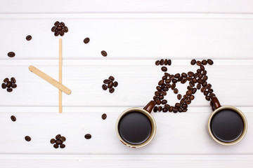 Clock and  figures of bike with coffee beans