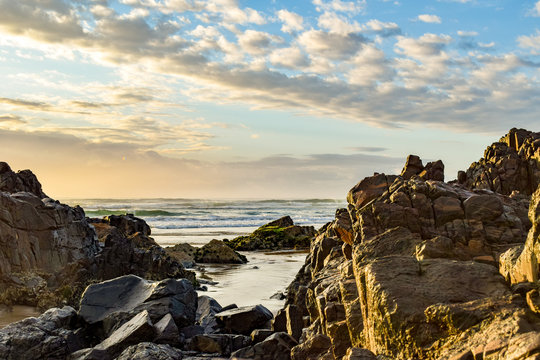 Australian beach coastline at 'Delicate Nobby' highlighting rock formations at low tide