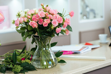 Bouquet of pink and white roses in vase