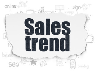 Advertising concept: Sales Trend on Torn Paper background