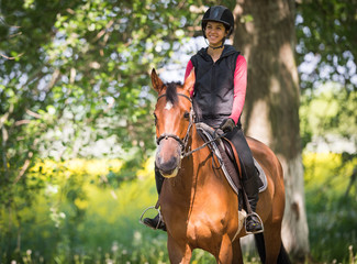 Young woman on a horse ride