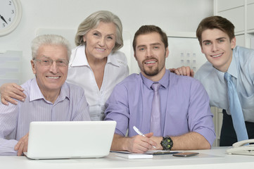 businesspeople at office with laptop