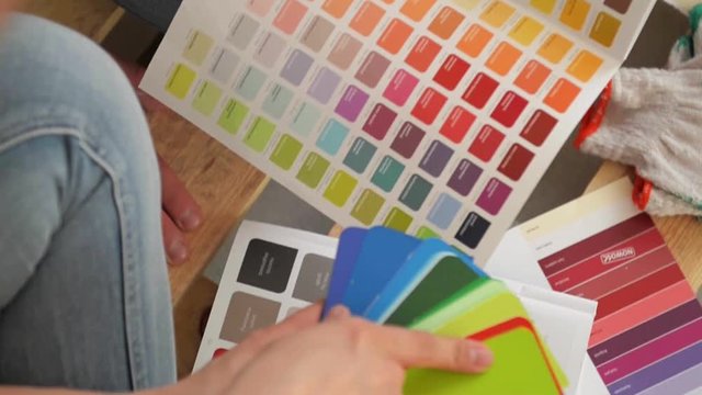 Young couple selecting a color for a condo, close-up