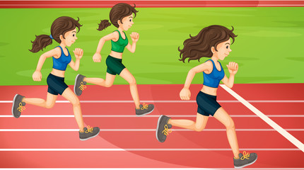 Three women running in the track