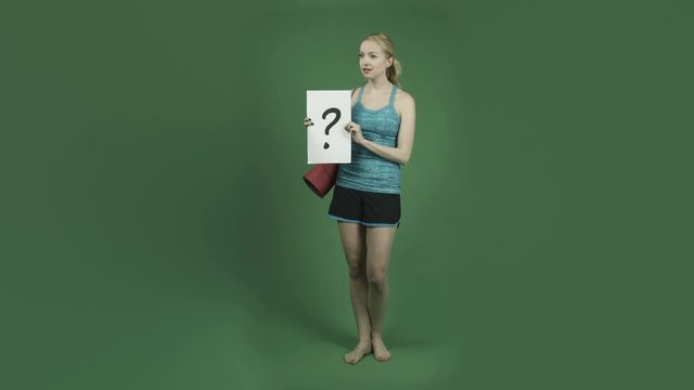 caucasian woman in sport yoga outfit isolated on chroma green screen background confused puzzled