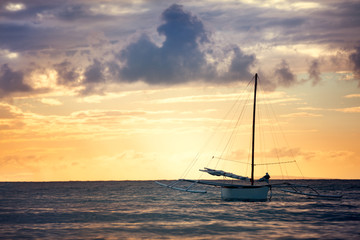 Fototapeta premium fishing boat sailing alone at sea
