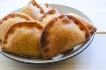 Closeup of typical spanish empanadillas, small meat or tuna fried pies.