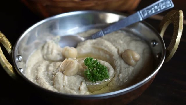 Pea mixes Hummus in brass pan ware at restaurant 