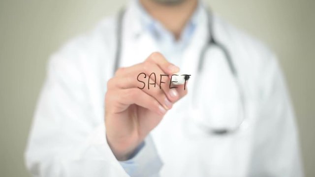 Safety, Doctor writing on transparent screen