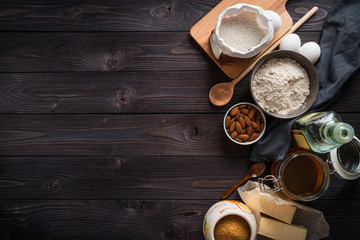 Ingredients for baking on a wooden background top view