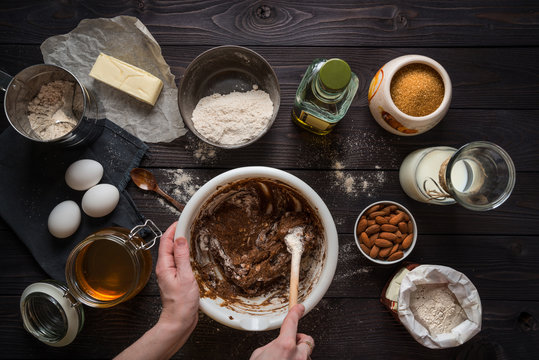 Kneading dough for baking among the ingredients, view from above.