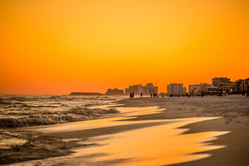 Fototapeta na wymiar orange sunset over gulf of mexico at destin fl