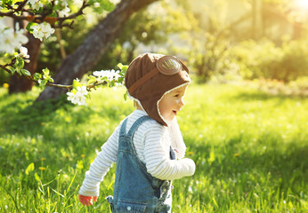 Boy playing in aviator hat