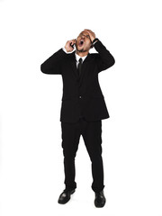 view of a businessman with head in hands.