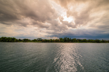 Evening storm over watershed and dramatic sky and clouds