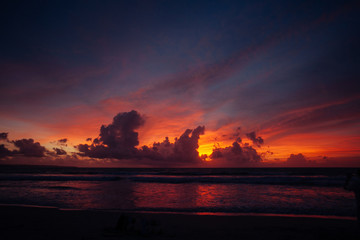 Calm peaceful ocean and beach on tropical sunrise. Bali, Indones