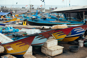 Fototapeta na wymiar Colorful fishing boats anchored at a Beach in Bali Island, Indon