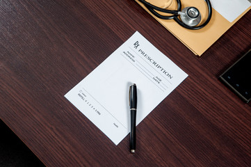 writing prescription / doctor writing prescription on the table