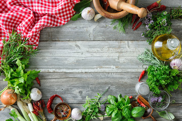 fresh herbs and spices on wooden table