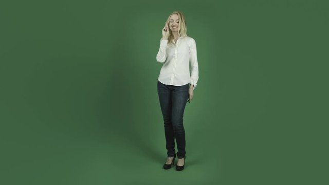 caucasian woman isolated on chroma green screen background fingers crossed