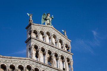 Fototapeta na wymiar Blue Eyed Angel Atop an Ornate Church Facade