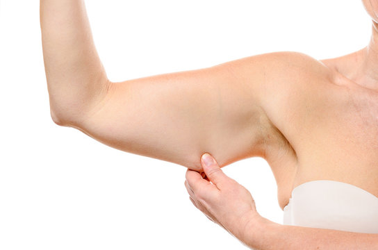 Close up woman stretching the skin under her arm