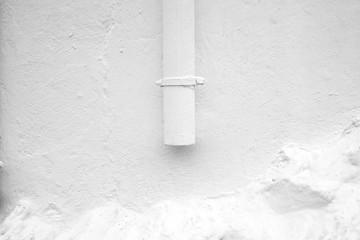 Texture of rough white wall with white pipe