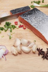 fresh raw salmon fillet on wood background.