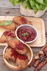Korean fried chicken is delicious on wood background.