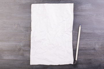 Crumpled paper and pen