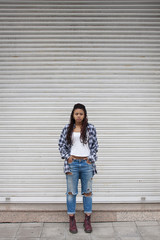 young woman with ripped jeans