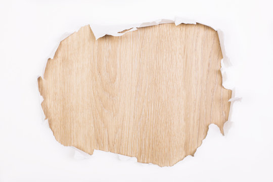 Torn paper wooden surface