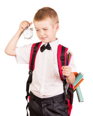 Cute boy with  red backpack in  hurry to school.