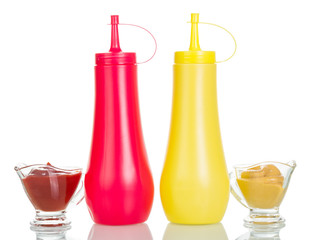 Bottles, cups with ketchup and mustard isolated on white.