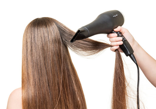 Long  hair, and hair dryer in  hand isolated on white.