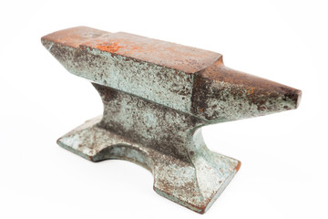 Old rusty rugged anvil foundry isolated white.