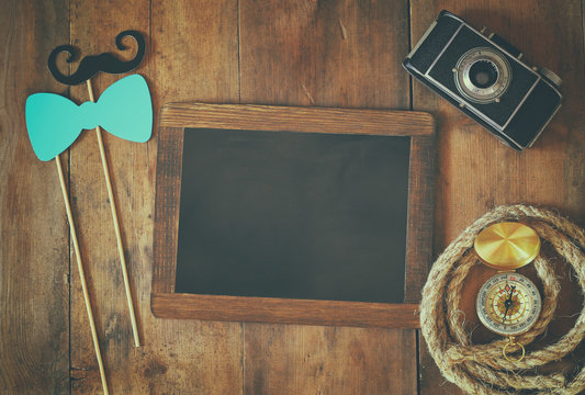top view of blank blackboard and man's vintage accessories
