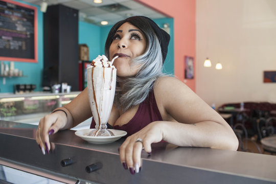Young woman in a diner.